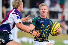 47th Kiama Sevens at Kiama Showground, Kiama, NSW. Dirty Red Matt Spratley closes in on Chris Prail of Bungendore in the Country Cup Final. Photo Rugby AU MediaStuart Walmsley